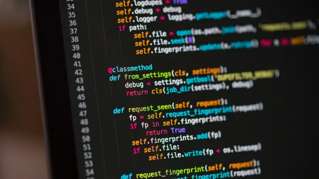 Developer workstation with code, terminal traces, and debugging tools open across multiple monitors