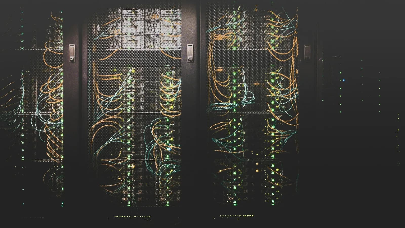 Server racks and blue security lights in a modern data center