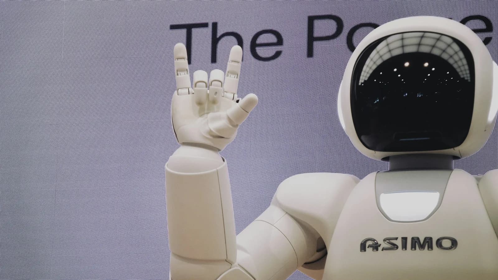 Humanoid robot and engineer working in a robotics laboratory